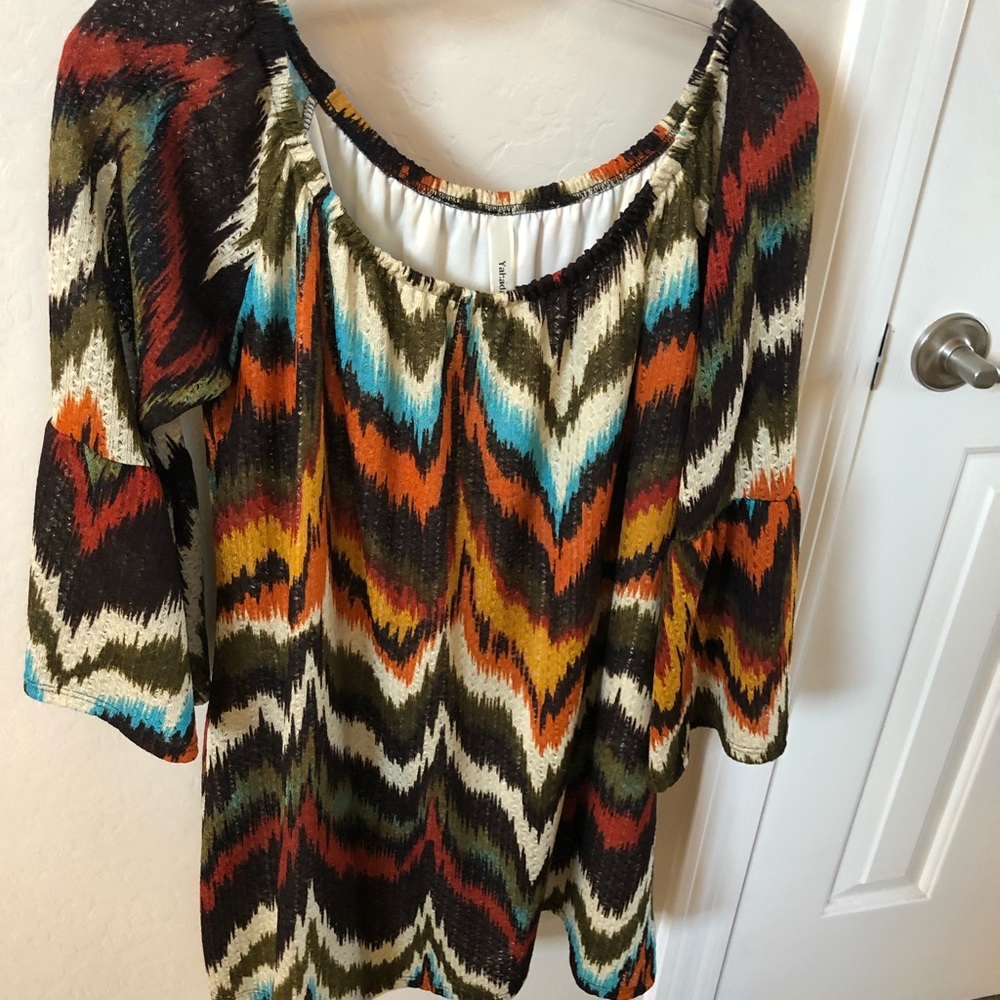 Blouse has pretty colors and ruffle sleeves